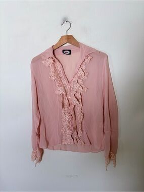 Vintage dusty pink sheer blouse featuring a cascading lace ruffle trim down the